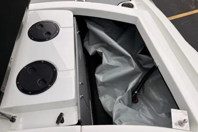 Slide: The Image of 2013 Centurion Enzo SV244 boat storage compartment with speakers and cover. - 21
