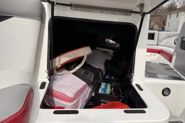 Slide: The Image of Storage compartment of a 2013 Centurion Enzo SV244 boat with life jackets and equipment. - 26
