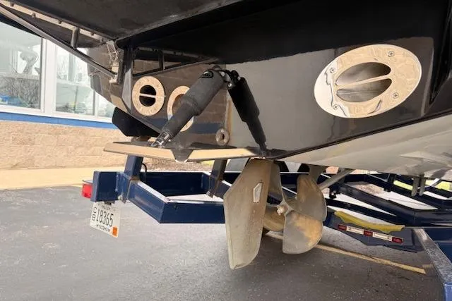 Slide: The Image of Rear view of a 2013 Centurion Enzo SV244 boat on a trailer, showing propeller and exhaust. - 27