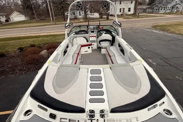 Slide: The Image of 2013 Centurion Enzo SV244 boat with spacious seating and sleek design. - 4