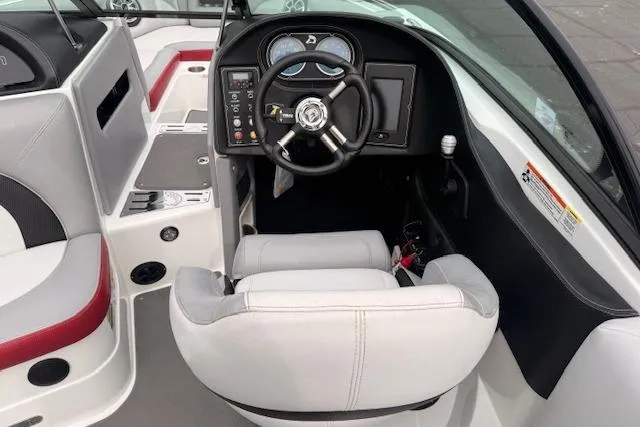 Slide: The Image of Interior of a 2013 Centurion Enzo SV244 boat showing steering wheel and dashboard. - 7