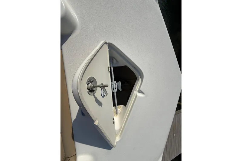 Slide: The Image of Open hatch on 2018 NauticStar 211 Coastal boat deck. - 19