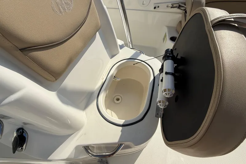 Slide: The Image of 2018 NauticStar 211 Coastal boat seat with storage compartment open. - 21