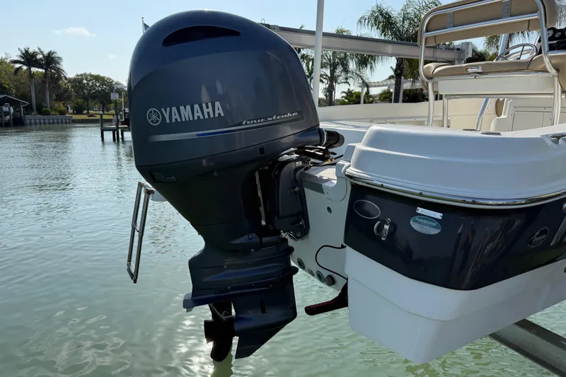 Slide: The Image of 2018 NauticStar 211 Coastal boat with Yamaha outboard motor on calm water. - 4