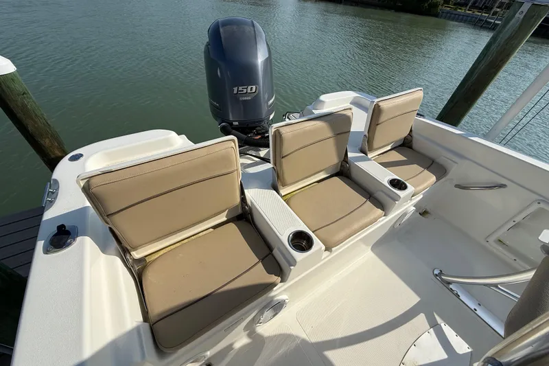Slide: The Image of 2018 NauticStar 211 Coastal boat with beige seating and Yamaha 150 engine. - 5