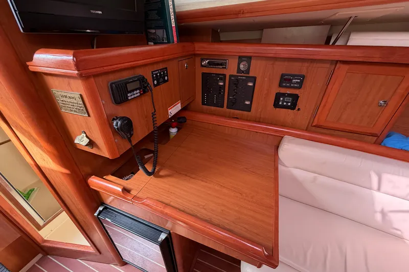 Slide: The Image of Navigation station of a 2008 Hunter 36 sailboat with communication equipment and control panels. - 20