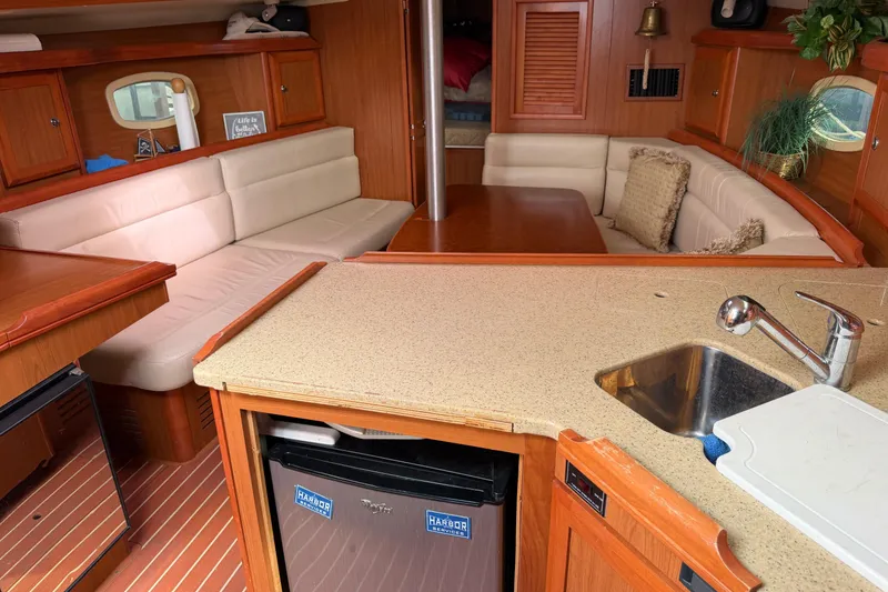 Slide: The Image of Interior of a 2008 Hunter 36 sailboat with cozy seating and kitchenette. - 34