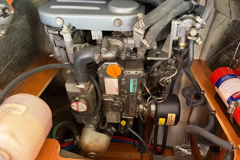 Slide: The Image of Engine compartment of a 2008 Hunter 36 sailboat, featuring detailed mechanical components. - 35