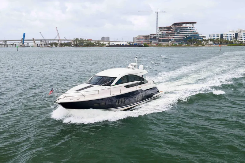 Slide: The Image of 2013 Fairline Targa 50 Open yacht cruising on water near urban skyline. - 70