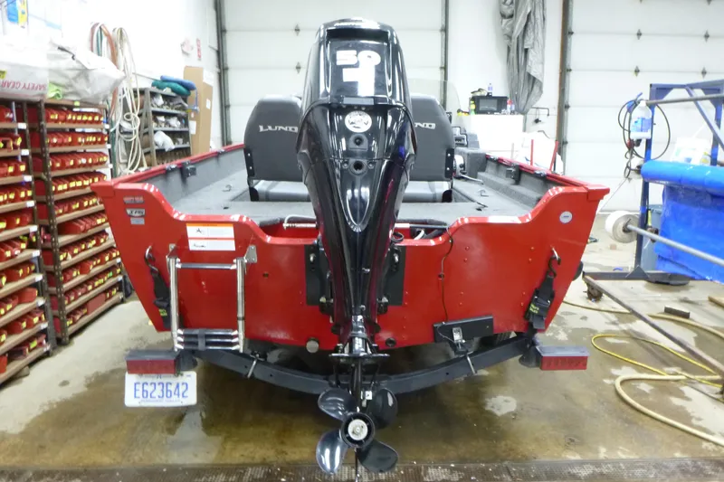 Slide: The Image of 2022 Lund 1650 Angler Sport boat in garage, rear view with motor. - 4