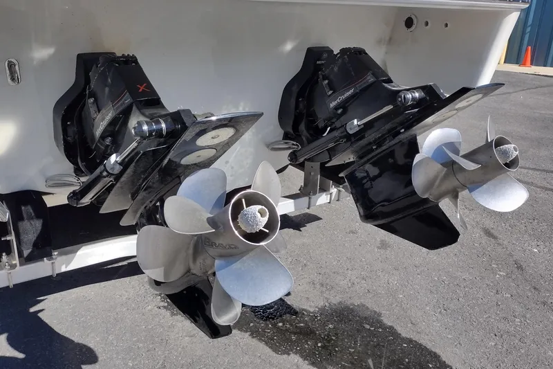 Slide: The Image of Dual propellers on a 2022 Formula 310 Bowrider boat, featuring MerCruiser drives. - 10