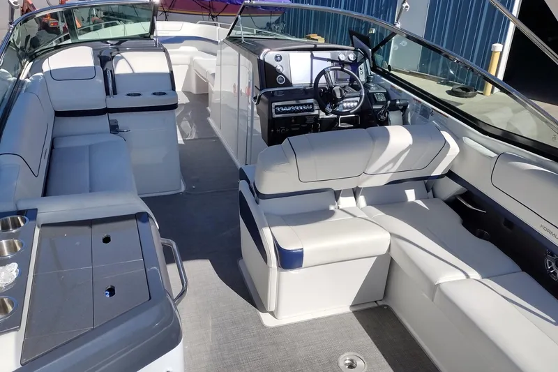 Slide: The Image of 2022 Formula 310 Bowrider interior with luxurious seating and modern dashboard. - 14