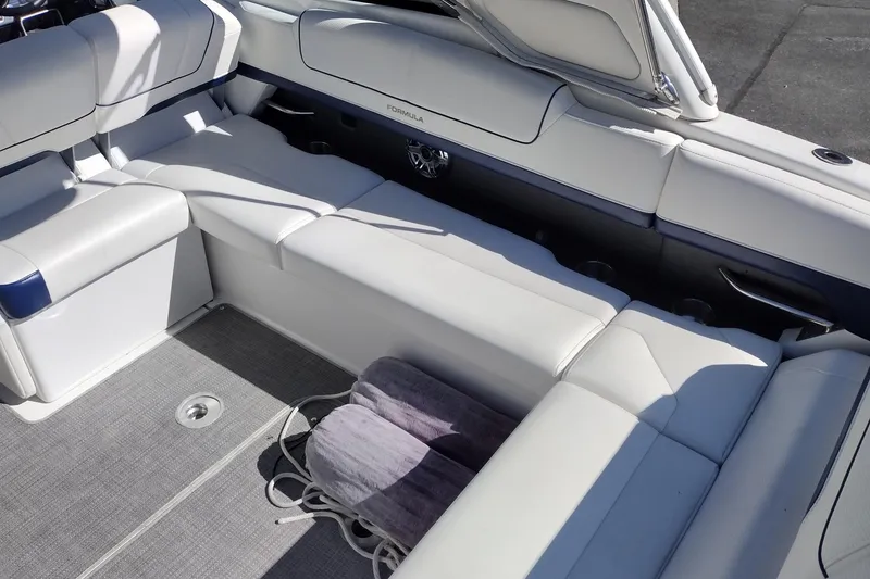 Slide: The Image of 2022 Formula 310 Bowrider interior with white seating and gray flooring. - 15