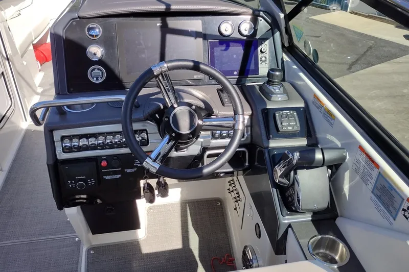 Slide: The Image of Cockpit of 2022 Formula 310 Bowrider with steering wheel and control panel. - 16