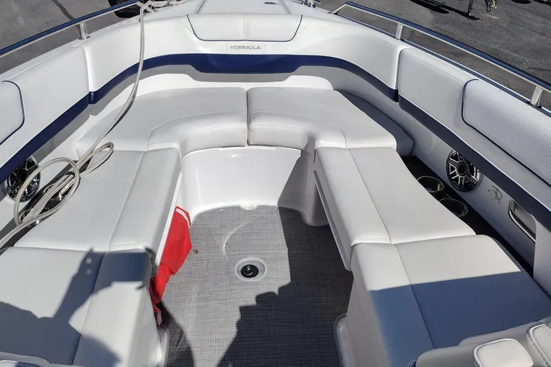 Slide: The Image of 2022 Formula 310 Bowrider interior with white seating and modern design. - 20