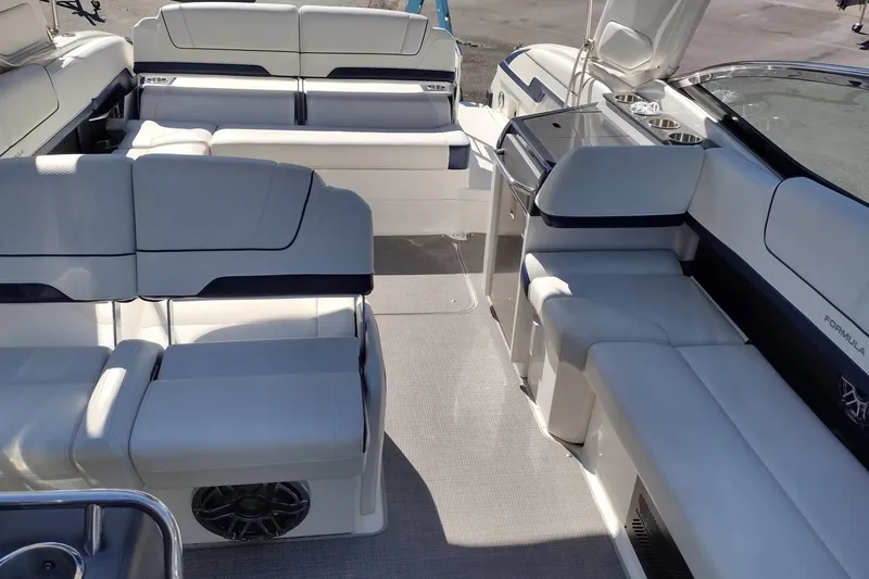 Slide: The Image of 2022 Formula 310 Bowrider interior with luxurious seating and modern amenities. - 21