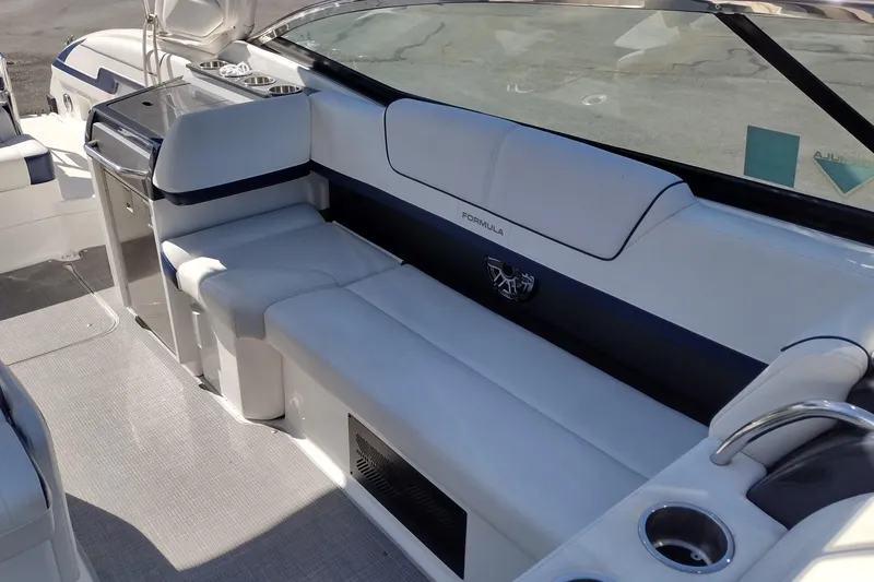 Slide: The Image of 2022 Formula 310 Bowrider interior with sleek seating and modern amenities. - 22