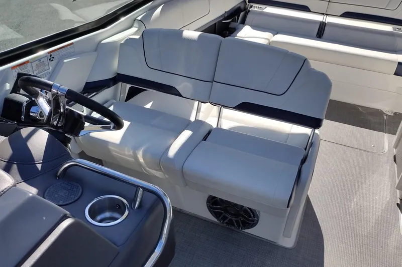 Slide: The Image of 2022 Formula 310 Bowrider interior with luxurious seating and modern steering console. - 23