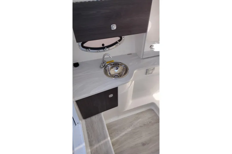 Slide: The Image of 2022 Formula 310 Bowrider interior sink and countertop detail. - 25