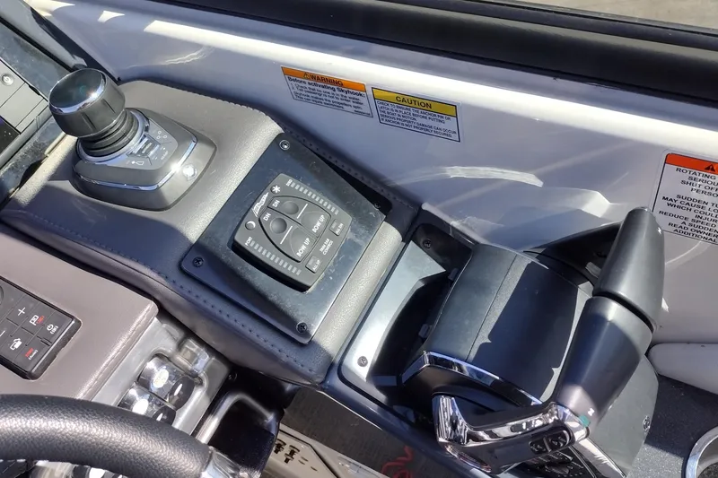 Slide: The Image of Control panel of a 2022 Formula 310 Bowrider boat with joystick and throttle controls. - 26