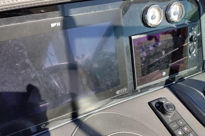 Slide: The Image of Dashboard of 2022 Formula 310 Bowrider with dual screens and control panel. - 27