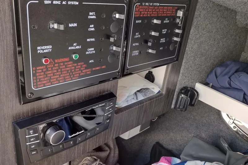 Slide: The Image of Control panel and stereo system inside a 2022 Formula 310 Bowrider boat cabin. - 30