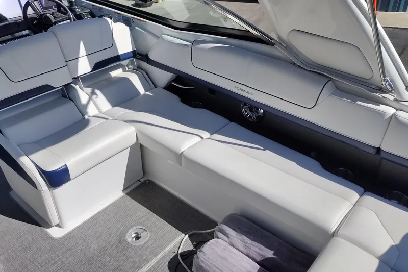 Slide: The Image of Luxurious seating in 2022 Formula 310 Bowrider boat, featuring sleek white upholstery. - 31