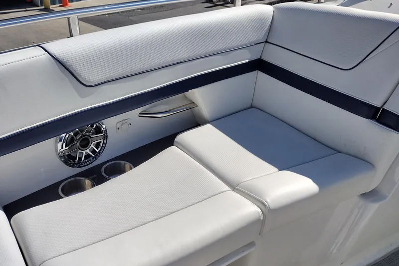 Slide: The Image of Luxurious seating on 2022 Formula 310 Bowrider boat with cup holders and speaker. - 34
