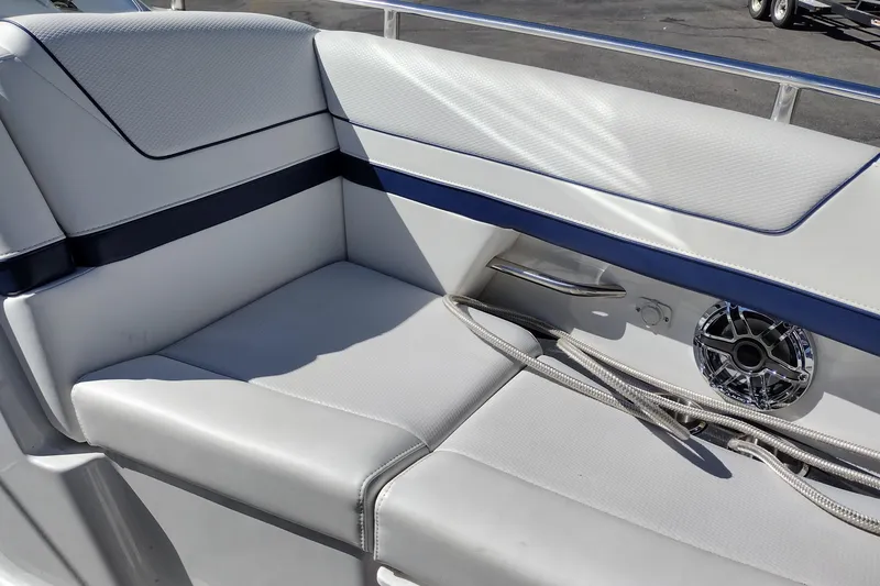 Slide: The Image of 2022 Formula 310 Bowrider interior with cushioned seating and speaker detail. - 35