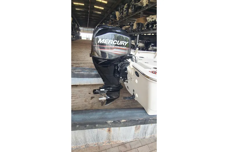 Slide: The Image of 2019 Boston Whaler 150 Montauk with Mercury outboard motor in storage facility. - 18