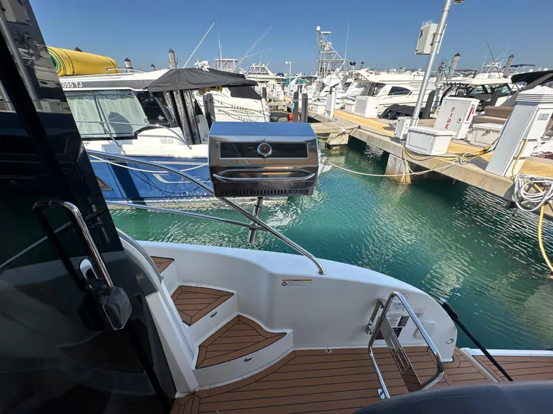 Slide: The Image of 2018 Bavaria S40 Coupe yacht with dockside view and onboard grill. - 25