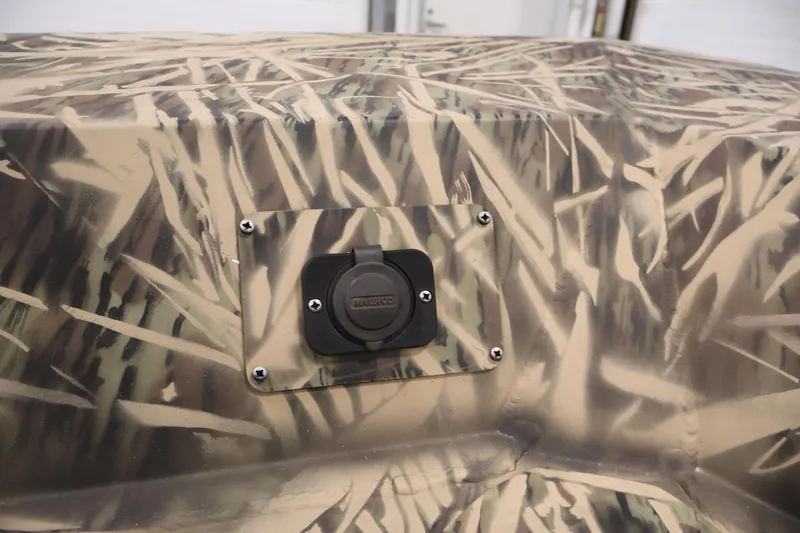 Slide: The Image of 2024 Crestliner 1870 Retriever FCC with camouflage pattern and a mounted plug socket. - 11