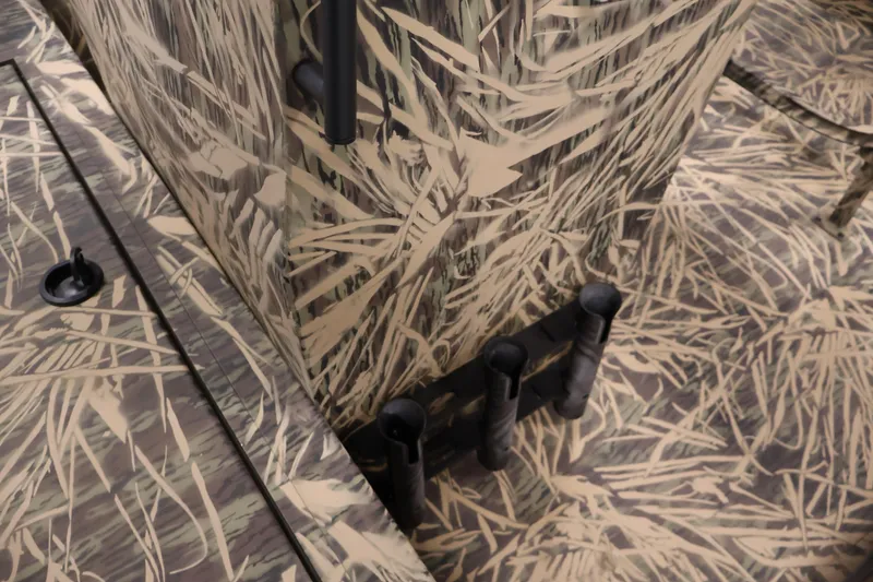 Slide: The Image of 2024 Crestliner 1870 Retriever FCC boat with camouflage pattern and rod holders. - 15