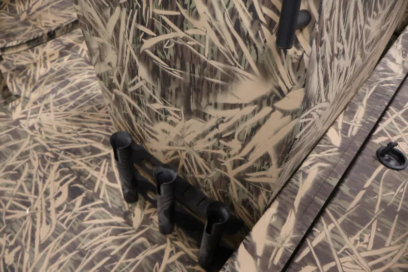 Slide: The Image of 2024 Crestliner 1870 Retriever FCC with camouflage pattern and rod holders. - 16