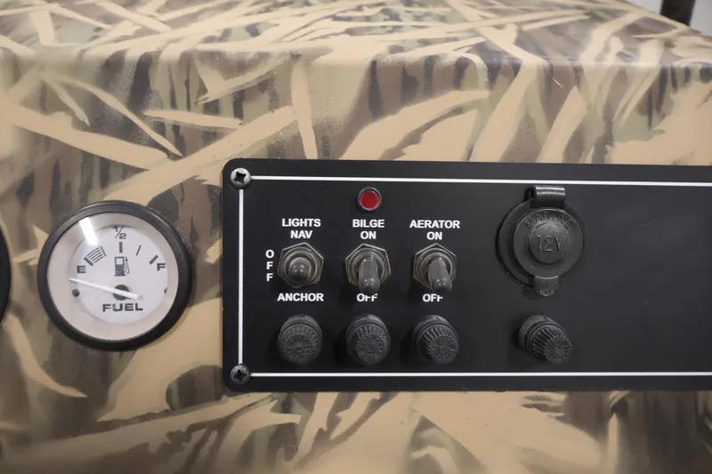 Slide: The Image of Control panel of 2024 Crestliner 1870 Retriever FCC with camouflage design and fuel gauge. - 20
