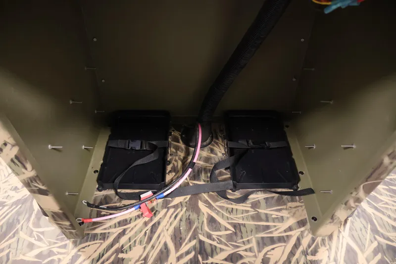 Slide: The Image of 2024 Crestliner 1870 Retriever FCC interior wiring and battery compartment detail. - 21