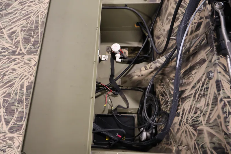 Slide: The Image of Interior view of 2024 Crestliner 1870 Retriever FCC boat wiring and components. - 24