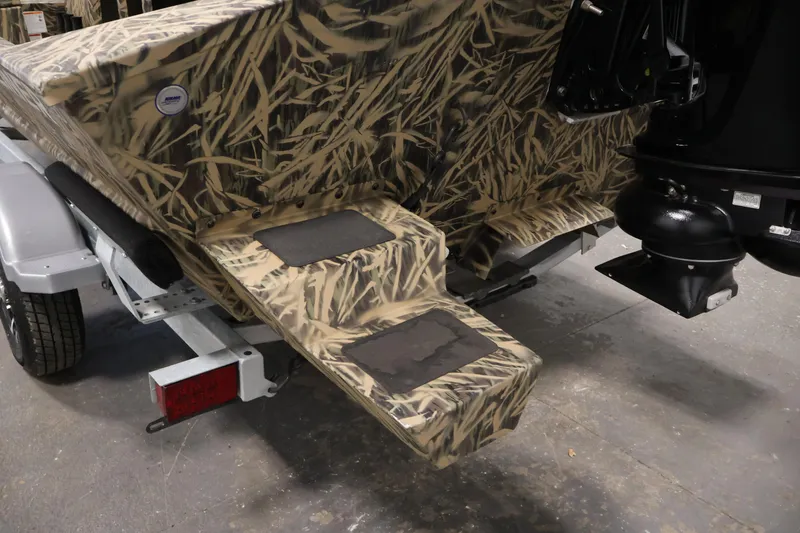 Slide: The Image of 2024 Crestliner 1870 Retriever FCC boat with camouflage design on trailer. - 27