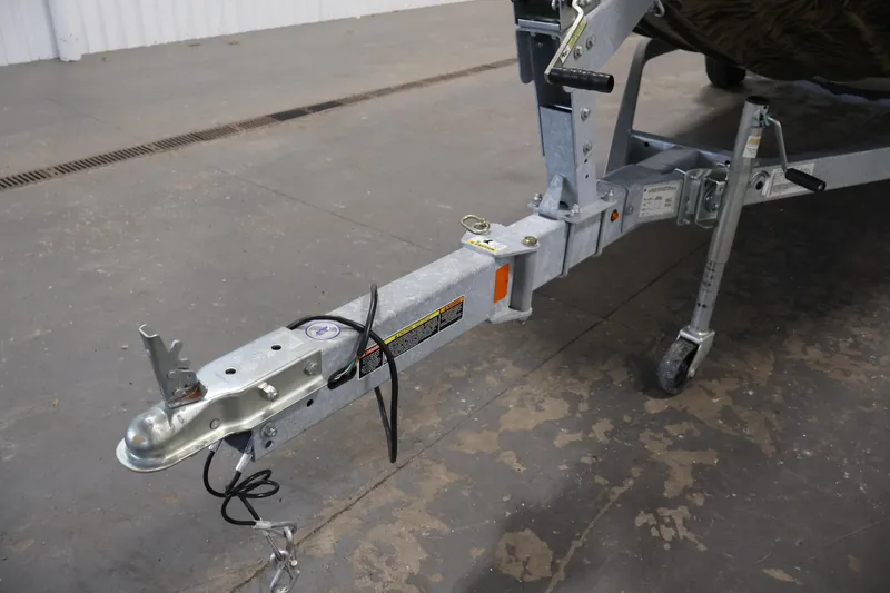 Slide: The Image of Trailer hitch of 2024 Crestliner 1870 Retriever FCC boat in a garage setting. - 32