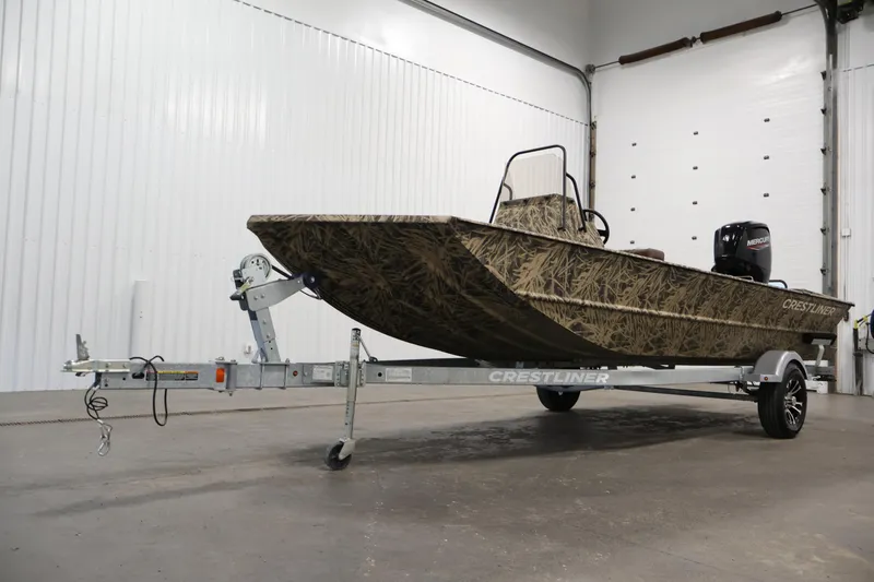Slide: The Image of 2024 Crestliner 1870 Retriever FCC boat on trailer in indoor setting. - 33
