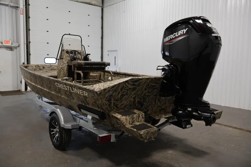 Slide: The Image of 2024 Crestliner 1870 Retriever FCC boat with camouflage design and Mercury outboard motor. - 7