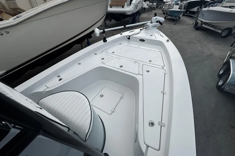 Slide: The Image of 2026 Piranha Casador B2200 boat interior with white seating and storage compartments. - 10