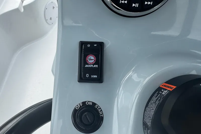 Slide: The Image of Control panel of 2026 Piranha Casador B2200 boat with jackplate switch and start button. - 25