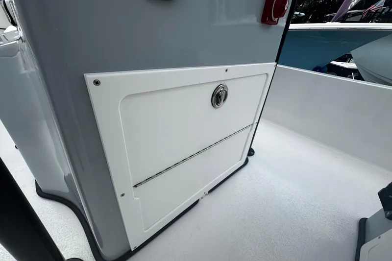 Slide: The Image of 2026 Piranha Casador B2200 boat interior with storage compartment and sleek design. - 30