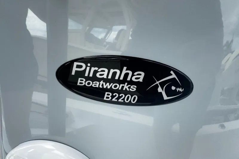 Slide: The Image of Piranha Casador B2200 boat logo, 2026 model, on a sleek surface. - 34