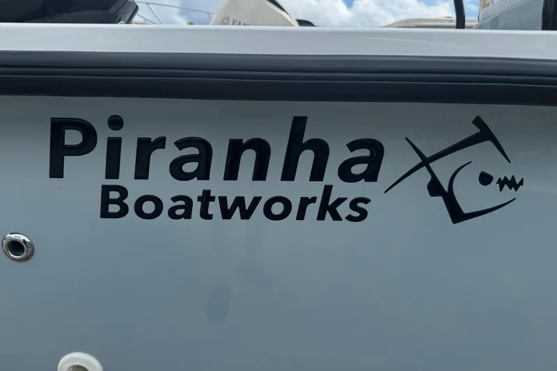 Slide: The Image of Piranha Boatworks logo on 2026 Casador B2200 boat exterior. - 4