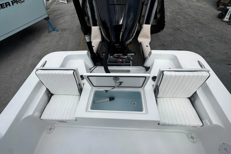Slide: The Image of 2026 Piranha Casador B2200 boat interior with white seating and central storage compartment. - 8