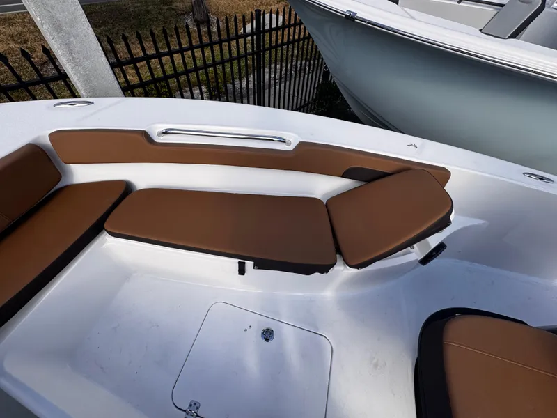 Slide: The Image of 2025 Sea Pro 202 Center Console boat with brown cushioned seating and white deck. - 19