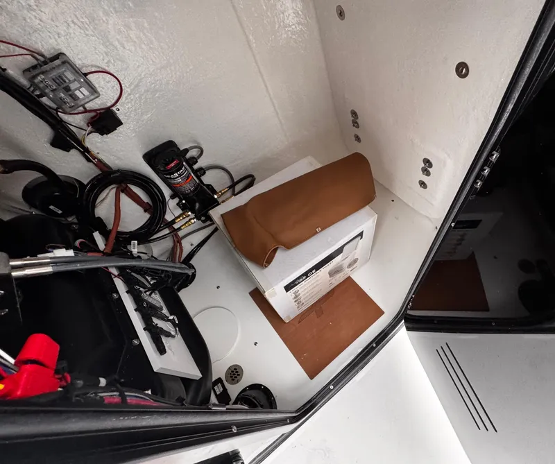 Slide: The Image of Interior view of 2025 Sea Pro 202 Center Console boat's storage compartment. - 25