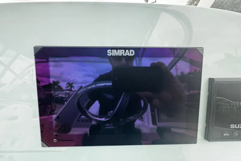 Slide: The Image of Simrad display on 2026 Sea Pro 240 Dual Console boat dashboard. - 13